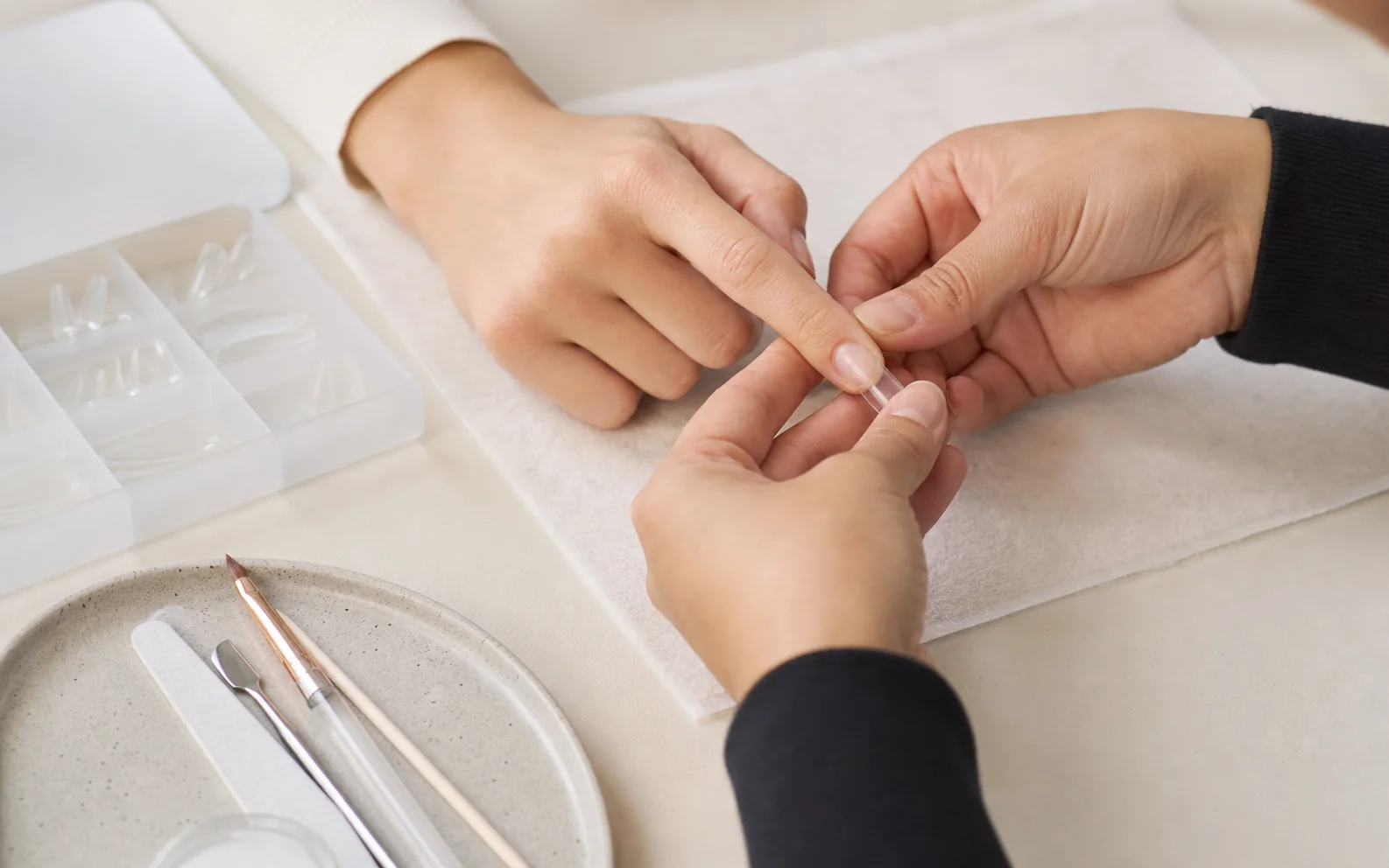Nail Extensions preparation and process at a College Station nail salon